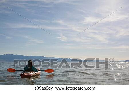 Rear view of young woman kayaker sitting in kayak on water, Great Salt Lake, Utah, USA View Large Photo Image Stock Photo - Rear view of young woman kayaker sitting in kayak on water, Great Salt Lake, Utah, USA. Fotosearch