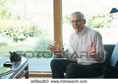 Senior man at home, laughing View Large Photo Image Stock Image - Senior man at home, laughing. Fotosearch
