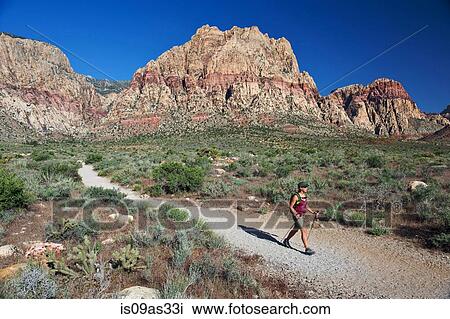 Side view of hiker walking along trail, First Creek, Las Vegas, Nevada, USA View Large Photo Image Stock Image - Side view of hiker walking along trail, First Creek, Las Vegas, Nevada, USA. Fotosearch