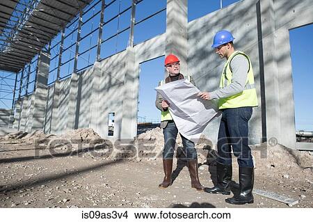 Picture - Surveyor and architect meeting on construction site. Fotosearch