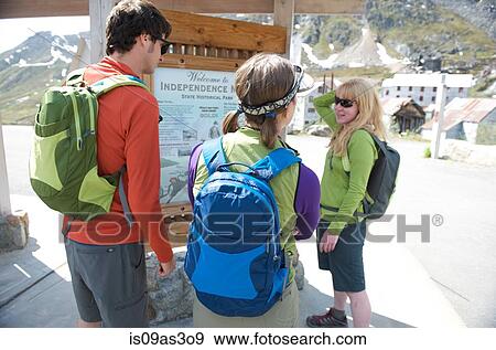 Stock Photo - Tourists looking at information board, Independence Mine State Historical Park, Hatcher Pass, Matanuska Valley, Palmer, Alaska, USA. Fotosearch