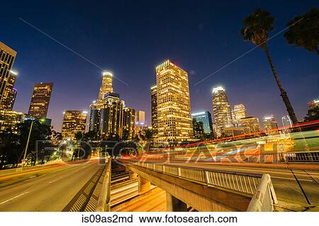 Stock Image - View of city skyscrapers and highway at night, Los Angeles, California, USA. Fotosearch