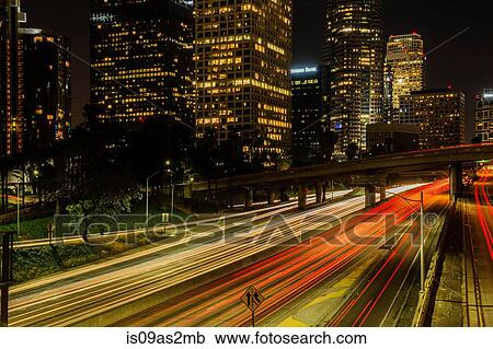 View of highway and city skyscrapers at night, Los Angeles, California, USA View Large Photo Image Stock Image - View of highway and city skyscrapers at night, Los Angeles, California, USA. Fotosearch