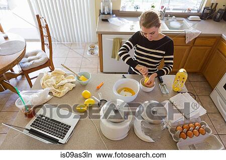 Woman baking in kitchen View Large Photo Image Picture - Woman baking in kitchen. Fotosearch