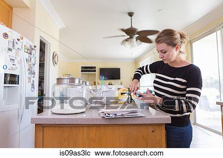 Woman baking in kitchen View Large Photo Image Stock Image - Woman baking in kitchen. Fotosearch