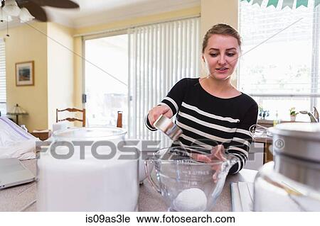 Woman baking in kitchen View Large Photo Image Stock Image - Woman baking in kitchen. Fotosearch