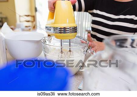 Woman baking in kitchen View Large Photo Image Stock Image - Woman baking in kitchen. Fotosearch