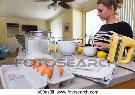 Woman baking in kitchen View Large Photo Image Stock Image - Woman baking in kitchen. Fotosearch