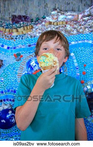 Stock Photo - Young boy eating icecream. Fotosearch