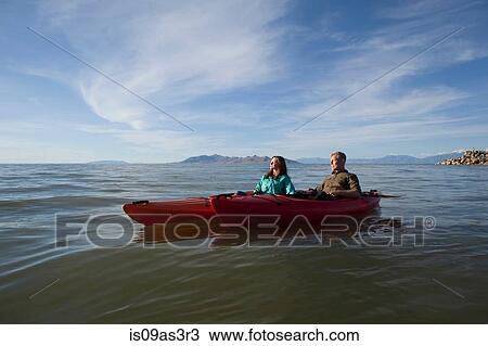 Young couple in kayaks on water, eyes closed looking away, Great Salt Lake, Utah, USA View Large Photo Image Stock Image - Young couple in kayaks on water, eyes closed looking away, Great Salt Lake, Utah, USA. Fotosearch
