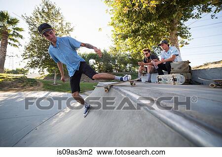Stock Image - Young man skateboarding in park, Eastvale, California, USA. Fotosearch