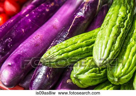 Brinjal and bitter gourd View Large Photo Image Stock Photo - Brinjal and bitter gourd. Fotosearch