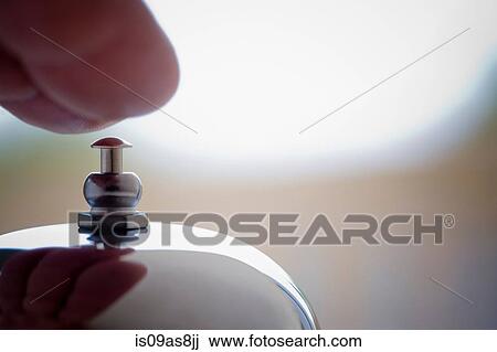 Cropped shot of hand reaching for silver counter bell View Large Photo Image Stock Image - Cropped shot of hand reaching for silver counter bell. Fotosearch