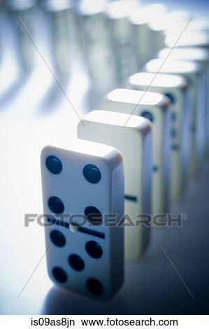 Dominos standing in a curved line View Large Photo Image Picture - Dominos standing in a curved line. Fotosearch