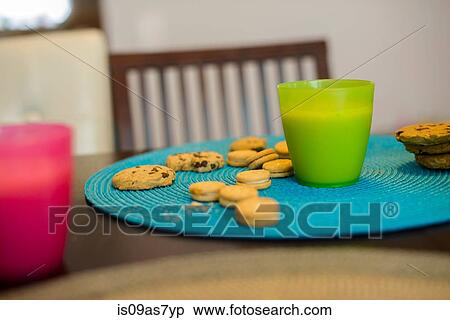 Stock Photography - Drink and cookies on table, still life. Fotosearch