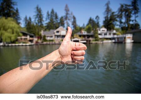 Hand of young woman making thumbs up on waterfront, Lake Oswego, Oregon, USA View Large Photo Image Stock Image - Hand of young woman making thumbs up on waterfront, Lake Oswego, Oregon, USA. Fotosearch