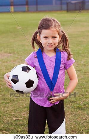 Portrait of girl football player with medal on practice pitch View Large Photo Image Stock Photograph - Portrait of girl football player with medal on practice pitch. Fotosearch