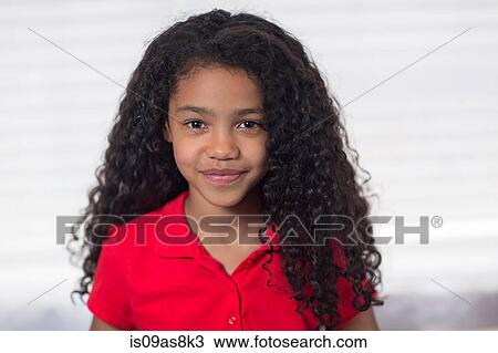 Portrait of girl with curly black hair looking at camera smiling View Large Photo Image Stock Image - Portrait of girl with curly black hair looking at camera smiling. Fotosearch