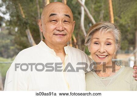 Stock Image - Portrait of senior couple, smiling. Fotosearch