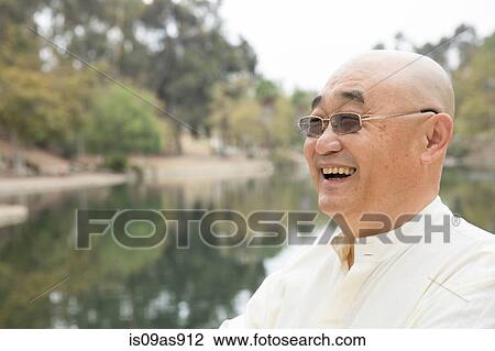 Portrait of senior man beside lake View Large Photo Image Stock Image - Portrait of senior man beside lake. Fotosearch