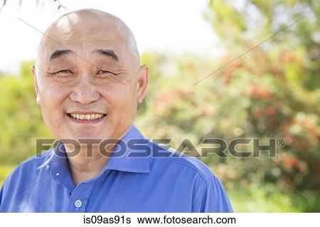 Stock Photograph - Portrait of senior man, outdoors, smiling. Fotosearch