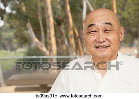 Stock Image - Portrait of senior man, smiling. Fotosearch