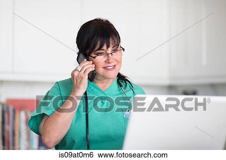 Senior female nurse using telephone View Large Photo Image Stock Photograph - Senior female nurse using telephone. Fotosearch