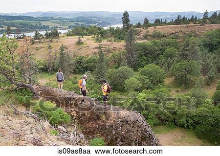 Small group of people hiking along ridge, elevated view View Large Photo Image Stock Image - Small group of people hiking along ridge, elevated view. Fotosearch