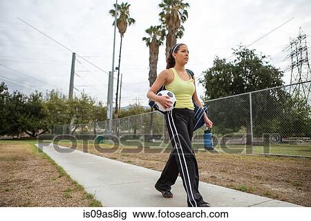 Soccer player leaving after practice in field View Large Photo Image Stock Image - Soccer player leaving after practice in field. Fotosearch
