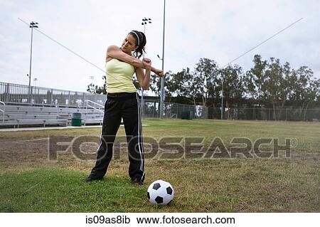 Soccer player stretching in field View Large Photo Image Stock Image - Soccer player stretching in field. Fotosearch