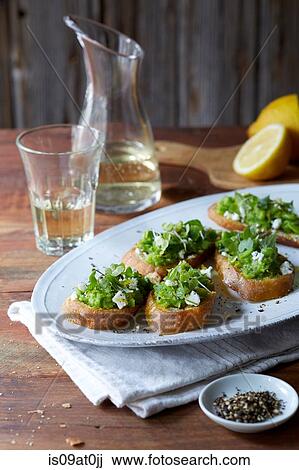 Still life of bruschetta with peas, goats cheese, salt and pepper View Large Photo Image Stock Image - Still life of bruschetta with peas, goats cheese, salt and pepper. Fotosearch