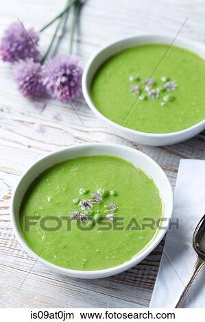 Still life of pea soup served with fresh chive and chive flowers View Large Photo Image Picture - Still life of pea soup served with fresh chive and chive flowers. Fotosearch