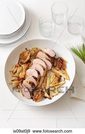 Still life of Pine-Roasted Pork Tenderloin with Parsnips and Onions View Large Photo Image Stock Photo - Still life of Pine-Roasted Pork Tenderloin with Parsnips and Onions. Fotosearch