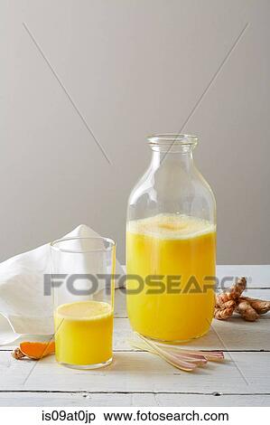 Still life of tumeric lemongrass lemonade in drinking glass and bottle View Large Photo Image Stock Photography - Still life of tumeric lemongrass lemonade in drinking glass and bottle. Fotosearch