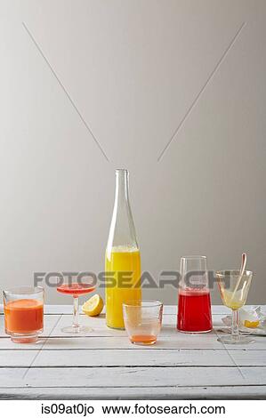 Still life variety of lemongrass lemonade, strawberry rose juice and ginger carrot juice in drinking glasses View Large Photo Image Picture - Still life variety of lemongrass lemonade, strawberry rose juice and ginger carrot juice in drinking glasses. Fotosearch