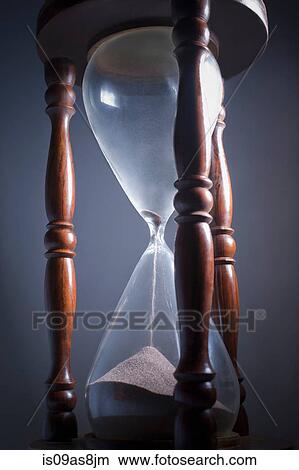 Studio shot of hourglass coming to an end View Large Photo Image Picture - Studio shot of hourglass coming to an end. Fotosearch