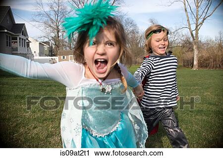 Children in costumes playing outdoors View Large Photo Image Stock Image - Children in costumes playing outdoors. Fotosearch