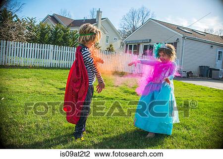 Children in costumes playing outdoors View Large Photo Image Stock Image - Children in costumes playing outdoors. Fotosearch
