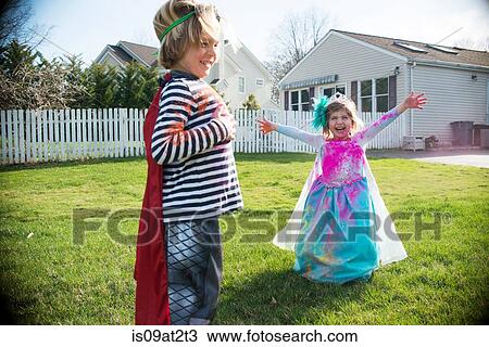 Children in costumes playing outdoors View Large Photo Image Stock Image - Children in costumes playing outdoors. Fotosearch