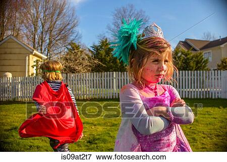 Stock Photo - Children in costumes sulking after fight. Fotosearch