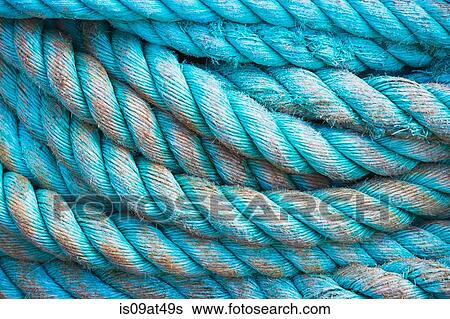 Close up detail of worn coiled blue rope View Large Photo Image Stock Photograph - Close up detail of worn coiled blue rope. Fotosearch