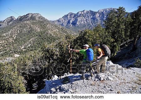 "Couple hiking, Mount Charleston Wilderness trail, Nevada, USA" View Large Photo Image Stock Photography - "Couple hiking, Mount Charleston Wilderness trail, Nevada, USA". Fotosearch