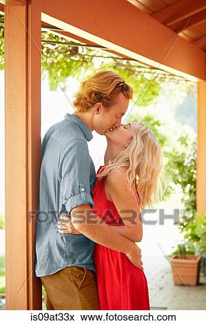 Couple kissing outdoors View Large Photo Image Stock Photo - Couple kissing outdoors. Fotosearch