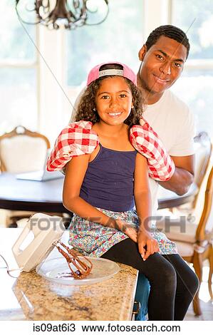 Father wearing oven gloves standing daughter hands on shoulders shoulders looking at camera smiling View Large Photo Image Stock Image - Father wearing oven gloves standing daughter hands on shoulders shoulders looking at camera smiling. Fotosearch
