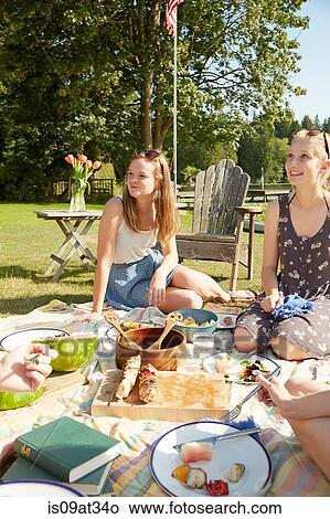 Picture - Friends enjoying lake party. Fotosearch