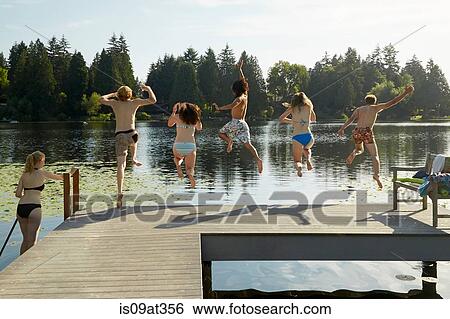Stock Photograph - "Friends having fun at lake, Seattle, Washington, USA". Fotosearch