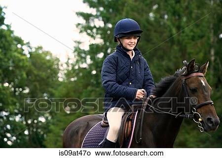 Girl horseback riding in countryside View Large Photo Image Picture - Girl horseback riding in countryside. Fotosearch
