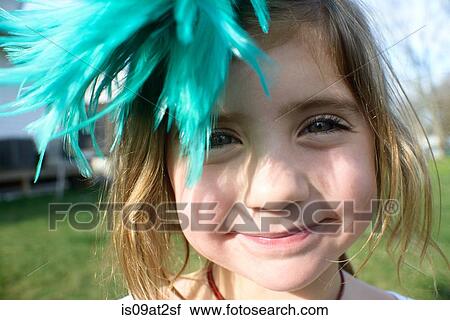 Girl with feather fascinator View Large Photo Image Stock Image - Girl with feather fascinator. Fotosearch