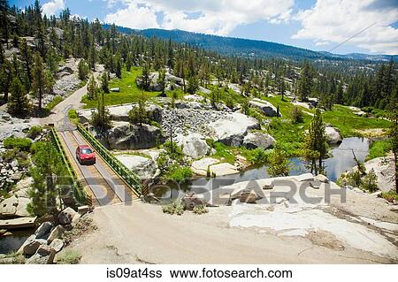 Stock Photograph - "High angle view of car crossing bridge, High Sierra National Park, California, USA". Fotosearch