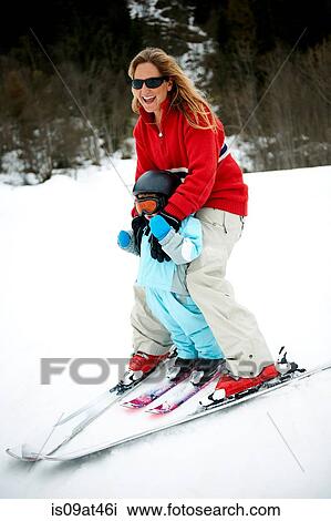 "Male toddler in front of mother skiing downhill, Les Arcs, Villaroger, Savoie, France" View Large Photo Image Stock Image - "Male toddler in front of mother skiing downhill, Les Arcs, Villaroger, Savoie, France". Fotosearch